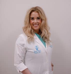 Smiling medical professional in white coat