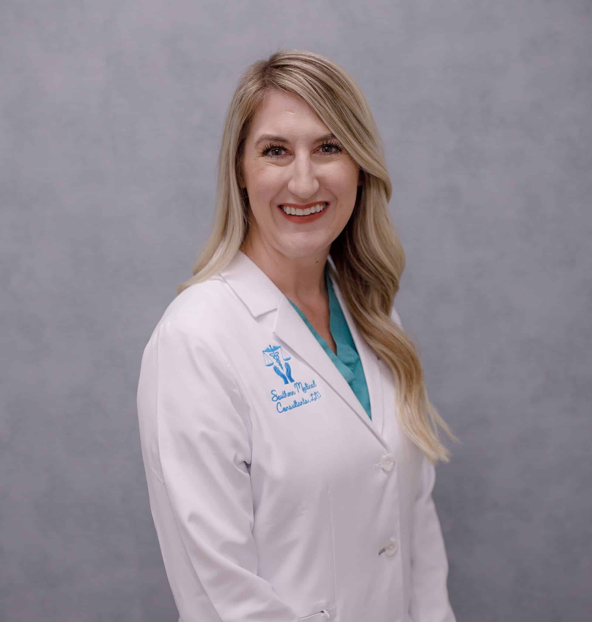 Smiling healthcare professional in white lab coat.